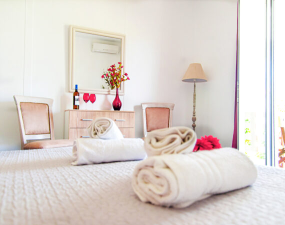 The coral room has a garden view with a private terrace.