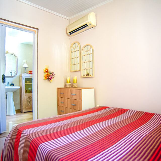 Guest room with attached bathroom.